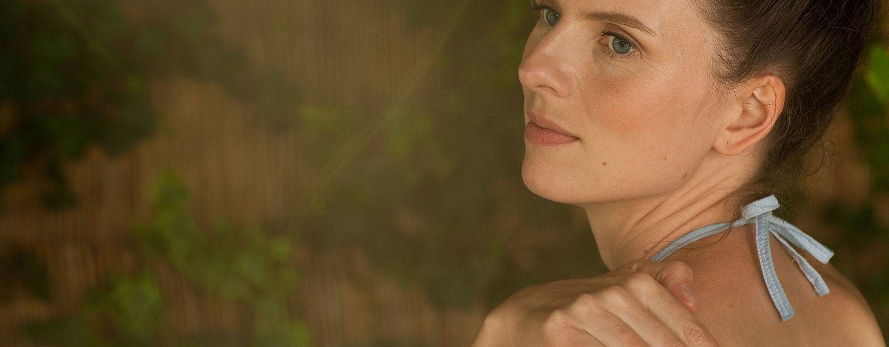 woman touching her skin